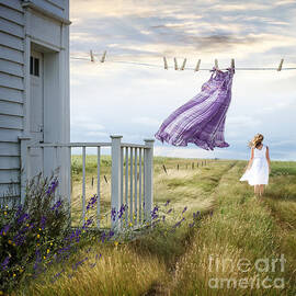 Summer dress blowing on clothesline with girl walking down path by Sandra Cunningham