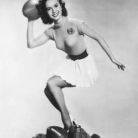 Debbie Reynolds Throws A Pass by Underwood Archives