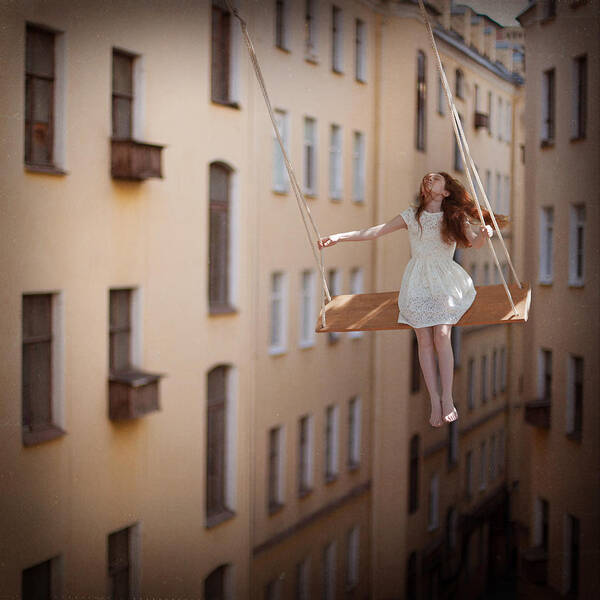 Woman on a Swing Between Buildings Wall Art